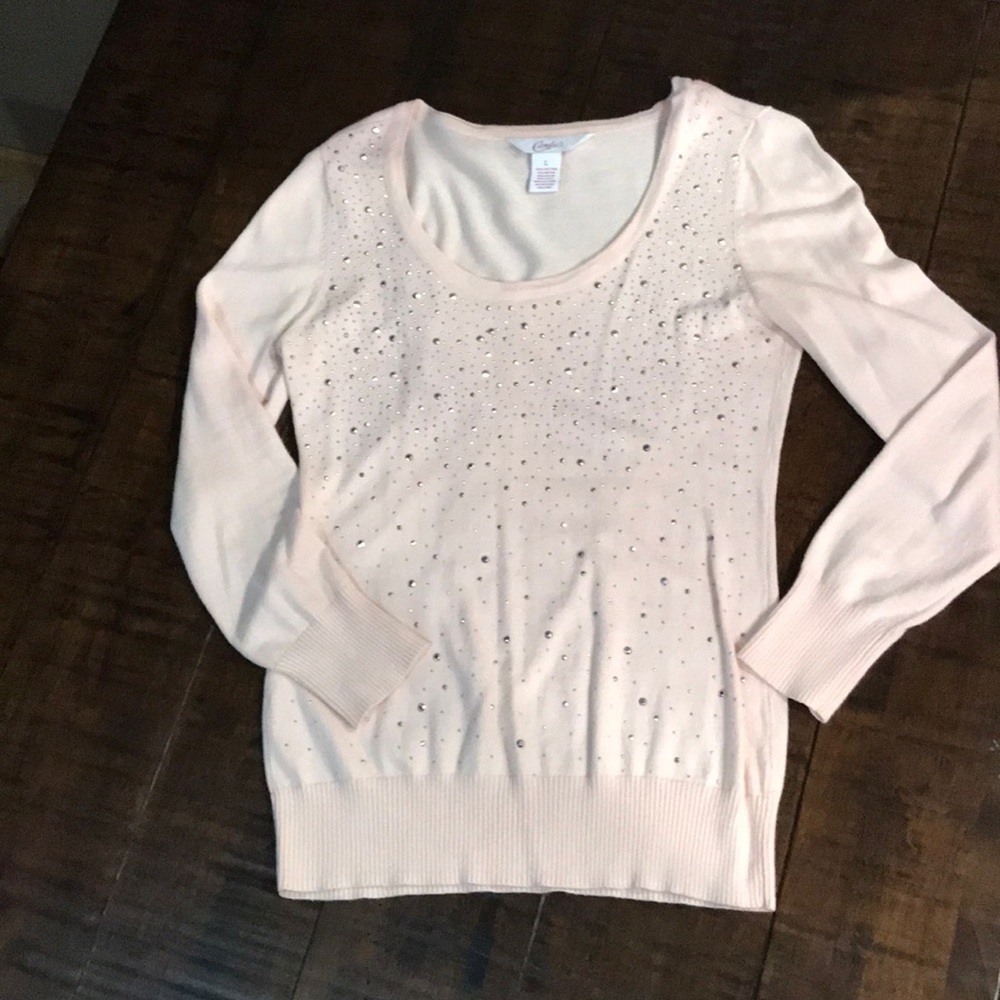 Candie’s light pink sweater
